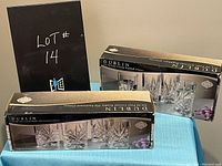 Boxes of Dublin Crystal glasses including set of four highball glasses and set of four old fashioned glasses, unopened and new in packaging.