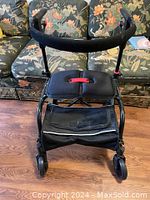 Front view showing frame, seat and storage pouch