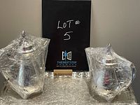 Photo showing the coffee pot and tea pot wrapped in cellophane along with the serving tray beneath.