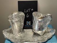 Full set of silver plated water jug, carafe and serving tray, all wrapped in protective cellophane.