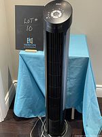 Front view of black Seville Classics tower fan, showing the fan, base, and top control panel.