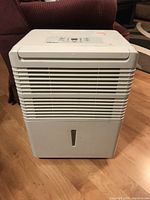 Front view showing white body, front vents, and water level window