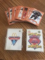 1991 Upper Deck McDonald's hockey cards spread with hologram cards in plastic holders, featuring various NHL players with orange back design