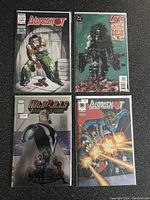 Photo shows all four comic books laid out on carpet: Bloodshot, Lobo, Wildcats, and another Bloodshot