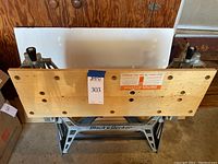 View of the wooden top surface with clamping handles and Black & Decker labeling on base.