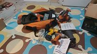 Full view of all tools including Saw, drills, impact driver, tool bag, charger, and some packaging