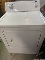 Front view of the white Inglis dryer showing control panel with cycle selector knob and start button.