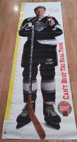 Full length view of the autographed Wayne Gretzky measuring poster showing hockey stick, uniform and measuring scale.