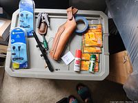 Overview of all hunting items including communication headsets, holster, warmers, paint, spray, and tape.