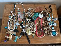 Overhead view of all jewelry pieces on wooden table