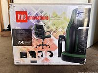 Photo of the front of the chair's box showing brand name, chair image and features.