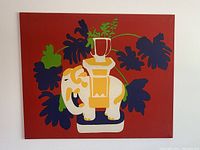 Full front view of the framed textile showing the bold red background with stylized elephant and large leaves in multiple colors.