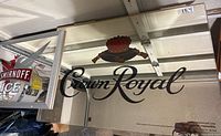 Mirror with Crown Royal logo and crown graphic on reflective glass
