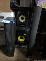 High end speakers including KRK VXT6 and ROKIT 8 studio monitors and two black soundbars.