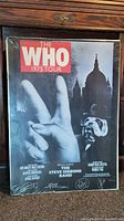 Full view of The Who 1975 Tour poster showing main design with peace sign hand, tour text, and bulldog figure.