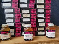 Glass bottles of Shiva linseed oil and sun-thickened stand oil, 2.1 fl. oz. each, with white caps.