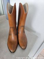 Front view of pair of Weather Guard boots, showing pointed toes and light brown leather with stitching detail.