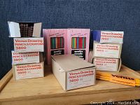 Image showing multiple boxes of Venus Drawing Pencils Crayons 3800 series, stacked with some open boxes revealing pencils inside.