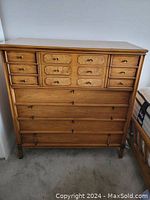 Front view of full dresser showing upper six decorative drawers and four lower full-width drawers