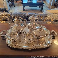 Full set displayed on ornate tray on wooden table