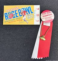 Photo showing the 1971 Rose Bowl ticket and the lapel button with ribbons and football charm.