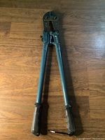Full length view of the Anvil bolt cutters showing metal handles with textured rubber grips and metal cutting head