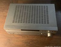 Top view showing metallic silver finish and ventilation slots.