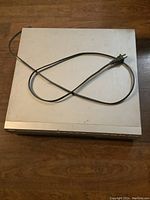 Top view of silver Sony 5 disc CD player with power cord, showing general condition and size.