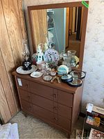 Full view of retro wooden dresser with large rectangular mirror. Several decorative items are placed on top of the dresser for scale and context.