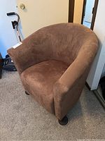 Front-left angle view showing the chair shape, fabric texture, and condition.