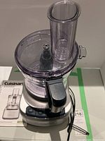 Front view of Cuisinart Elemental 8 Food Processor including base, bowl with lid, and feed tube.