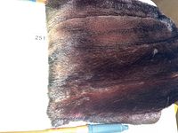Photo of brown fur exterior side of lap blanket showing texture and color.