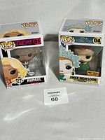 Both Funko Pop figures in original packaging displayed side by side revealing box fronts and figure designs.