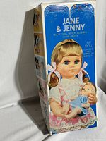 Photo of original box with large Jane & Jenny branding, showing the doll set with a 19.5 inch doll and 6.5 inch baby doll.
