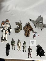 Full lot overview showing all figures and vehicles on white cloth background