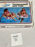 Box showing the Intex Wet Set transparent sun tube, new in packaging, 39 inch size with photo showing two people using the tubes in the pool.