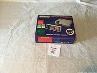 CoolBaby Mini HDMI TV Game Console box showing the console and one controller, stating 600 built-in games and HDMI HD video output