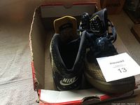 Top view of men's Nike Air BK shoes showing the inside and heel with Nike logo and label on tongue.