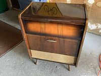 Full front view of the 1959 Blaupunkt radiogram showing the wooden cabinet, fabric speaker grille, and radio panel with knobs.