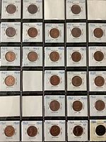 Photo of Canadian 1 cent penny coins in plastic holders with handwritten year and condition, showing coins from 1950 to 1964 in excellent condition.