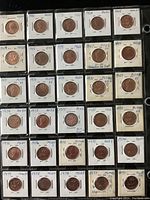 Photo showing the full collection of Canadian 1 cent pennies from 1965 to 1979 in protective holders with grading and variety notes.