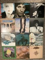 Full view of all 12 vinyl LP record covers arranged in a 3x4 grid showing front artwork and titles of various artists.