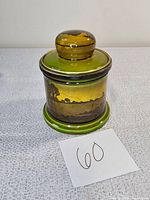 Front view of the Royal Doulton ceramic humidor with signed vintage landscape design and matching lid with knob.