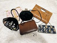 Overview of six vintage purses including faux crocodile leather, faux snakeskin leather, velvet, and beaded fabric clutch