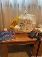 Front view of serger and accessories on wooden table