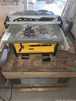 Angled overview showing three spare circular blades placed on table surface