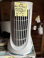 Front view of Honeywell air purifier with label showing size 16 x 9 inches