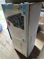 Box packaging of the artificial Christmas tree labeled '14 Christmas Tree - Sparkling Pine 7.5ft'.