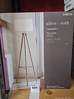 Boxed Allen Roth Amesbury floor lamp showing gray finish and white shade with dimensions.