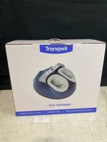 Front view of the Tranqwil M1 foot massager box showing image of the foot massager and brand
